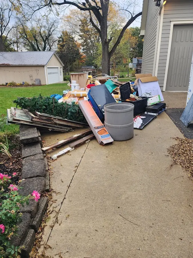Dumpster being loaded with debris for 3 Yard Dumpster Rental in Guilderland